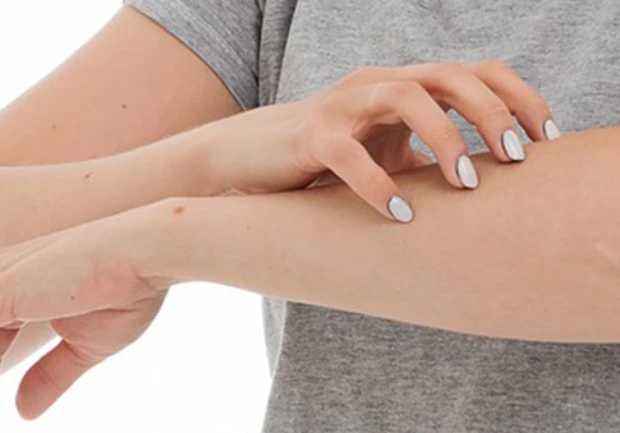 A person scratching their arm